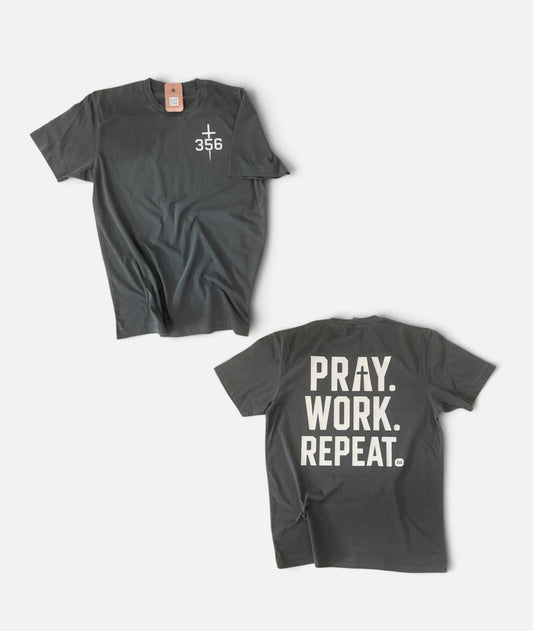 Two views of a dark gray crewneck t-shirt on a light gray background. The top view shows a small white cross and '356' printed on the left chest.