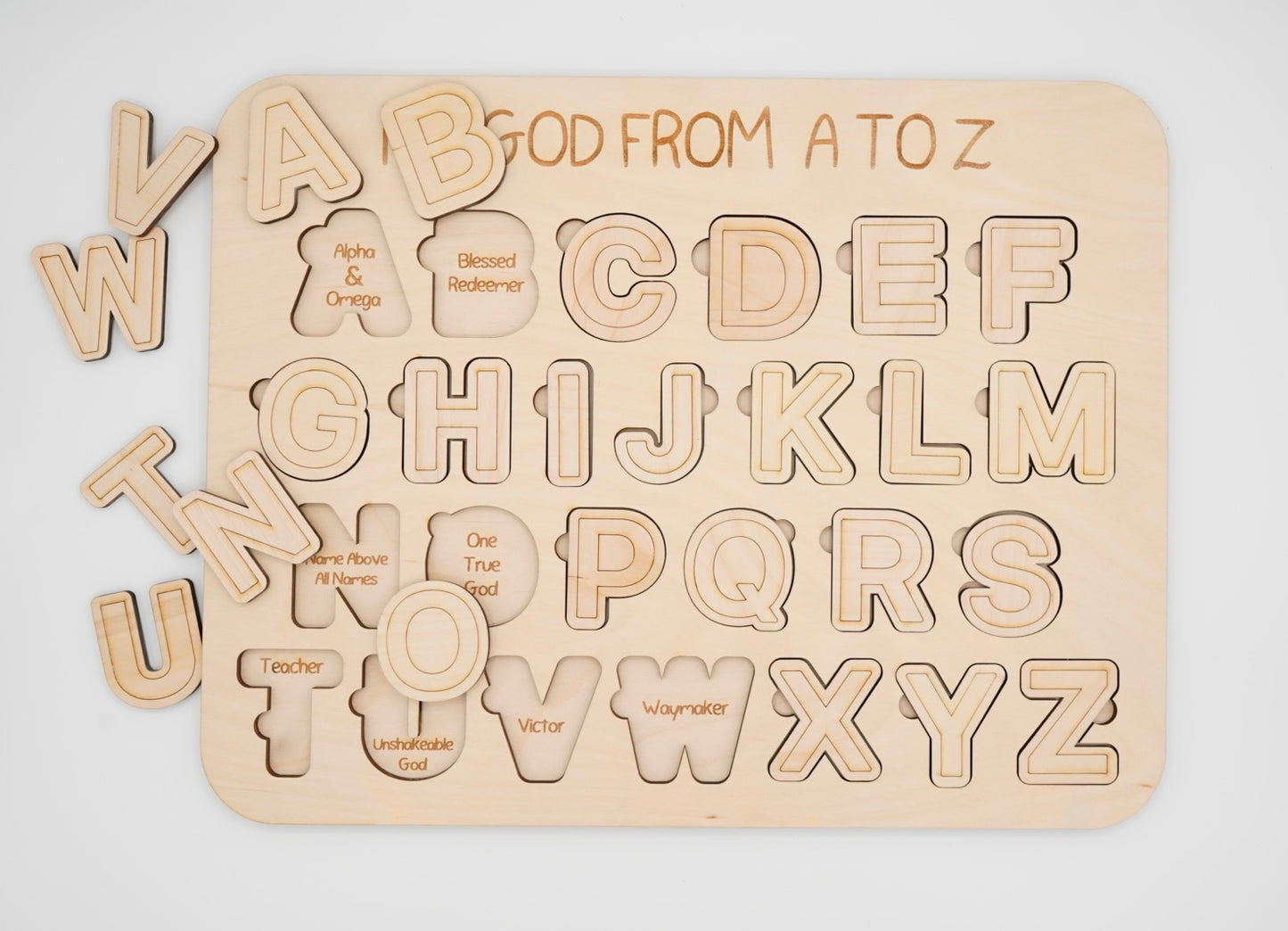 Wooden alphabet puzzle with letters from A to Z with each letter depicting a name for God laser engraved unerneath.