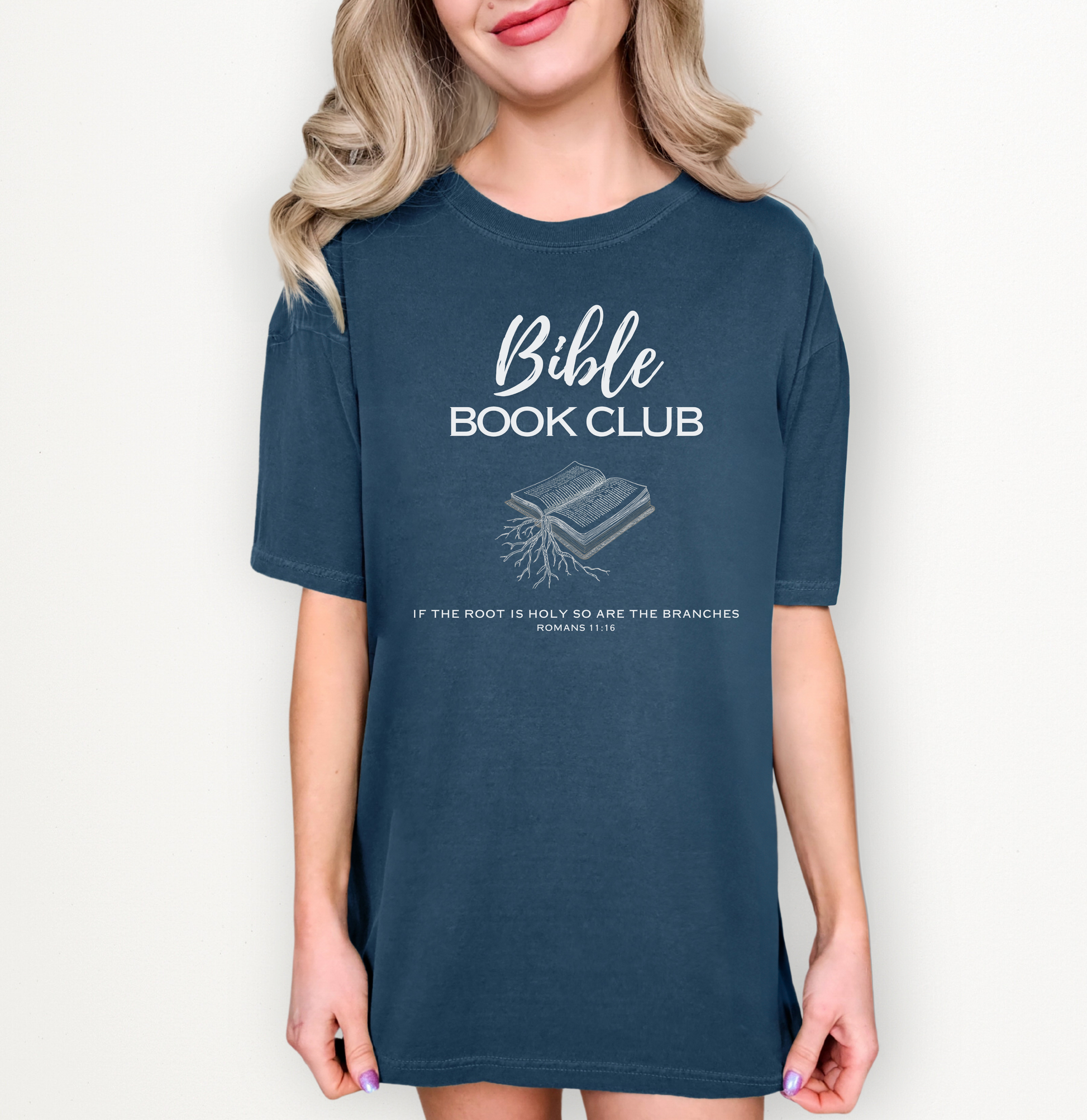 Female model wearing a navy tshirt with a Bible Book Club design in white