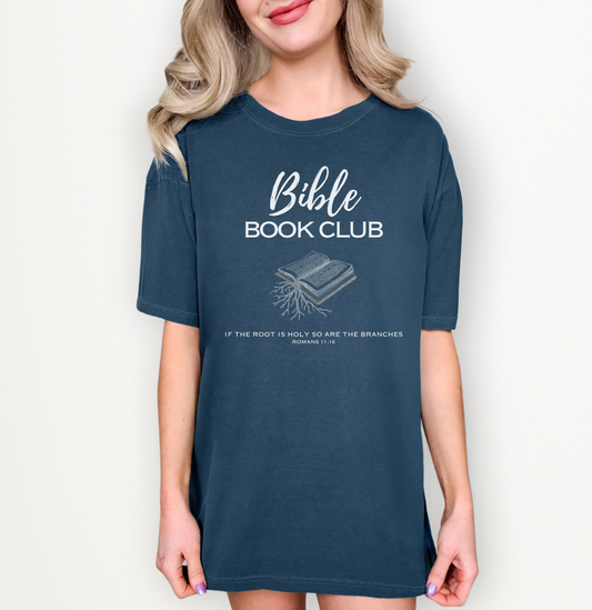 Female model wearing a navy tshirt with a Bible Book Club design in white