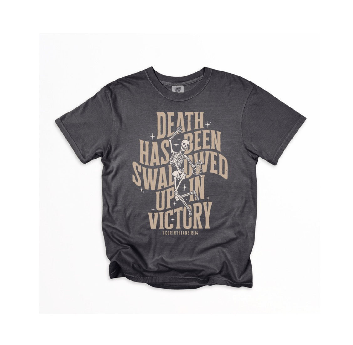 A dark charcoal gray graphic t-shirt featuring a distressed beige and white print of a skeleton and the text 'DEATH HAS BEEN SWALLOWED UP IN VICTORY' with 'COURTYARD 54' below, displayed on a clean white background.