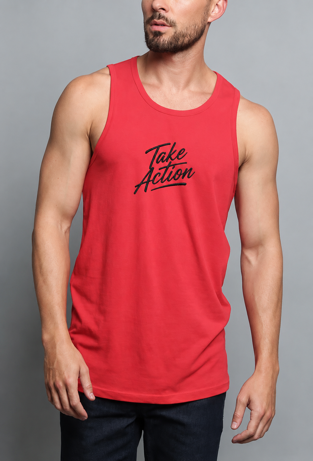 A man wearing a red sleeveless tank top with 'Take Action' printed in black script across the chest, photographed against a plain gray studio background.