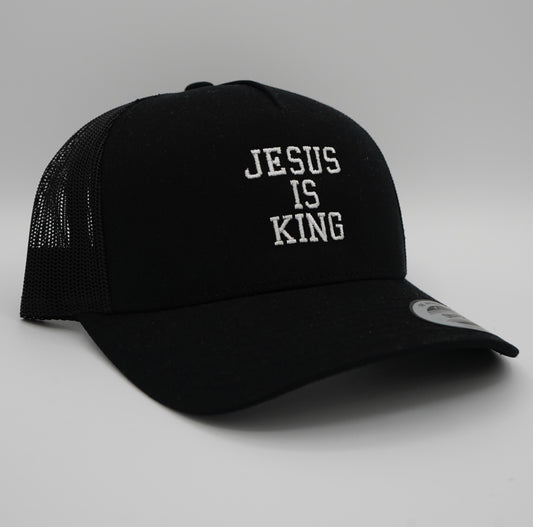 Black hat with the text 'Jesus is King' embroidered in the center in white, side profile display.