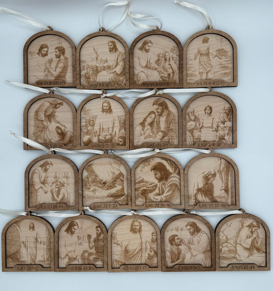 Set of wooden ornaments that depict laser engraved scenes throughout the life of Jesus. Each ornament has the specific bible verse engraved that the scene depicts.