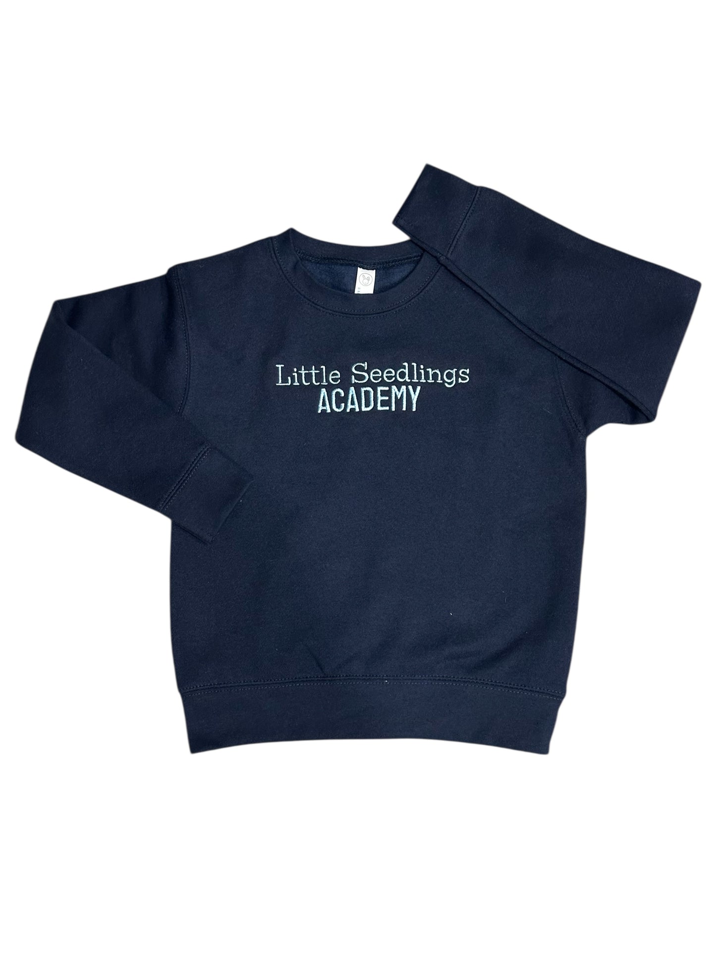 Navy blue sweatshirt with 'Little Seedlings Academy' text embroidered on front center chest in light blue.