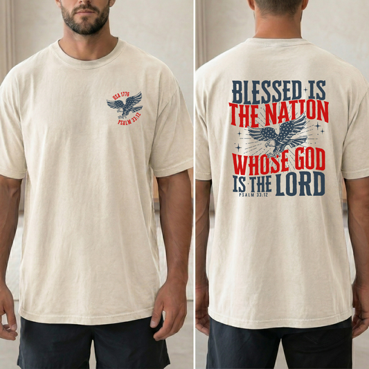Beige t-shirt with eagle graphic and text on front and back worn by a person.