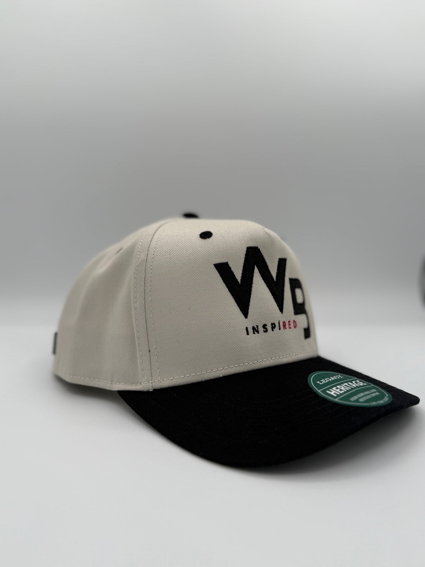 Beige and black cap with 'WP' logo on a light gray background